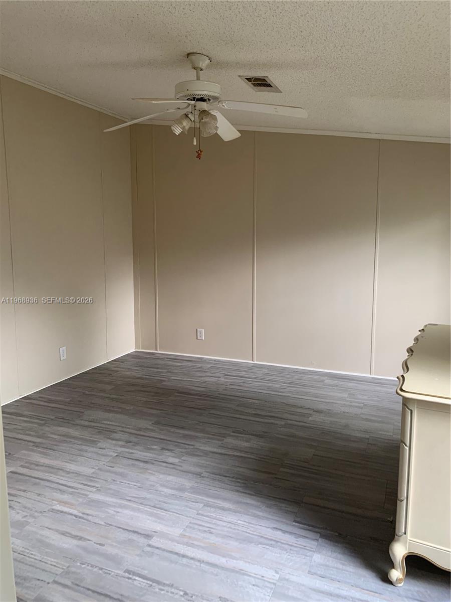 Watergate Boca Raton, FL 33428 - Photo 9 of 19 a view of empty room with wooden floor