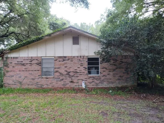 a backyard of a house with lots of green space