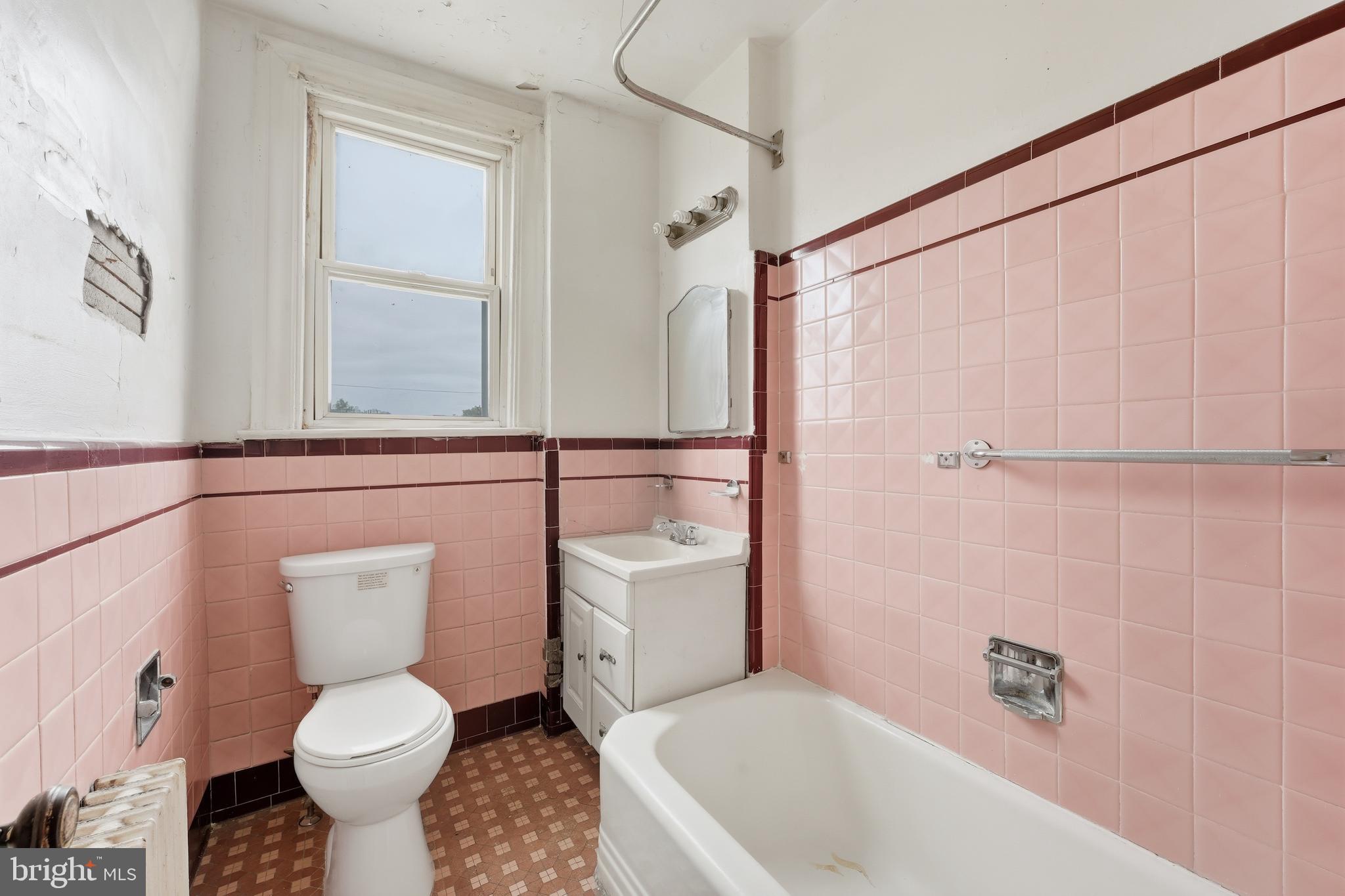 726 Somerset Place Northwest Washington, DC 20011 - Photo 15 of 28 a bathroom with a sink toilet and shower