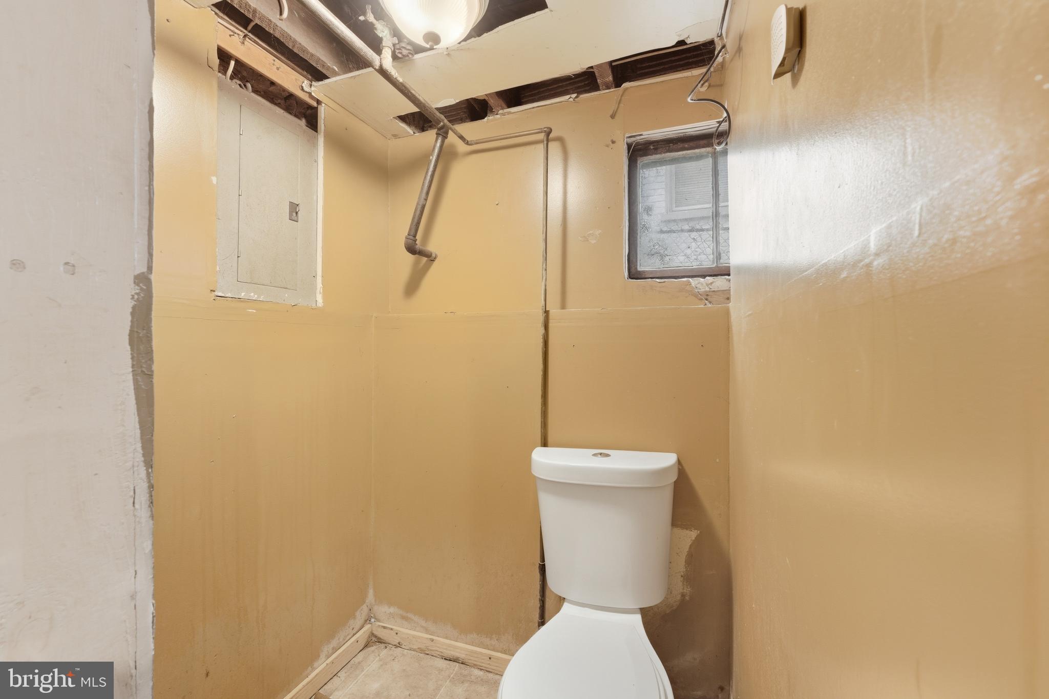 726 Somerset Place Northwest Washington, DC 20011 - Photo 24 of 28 a white toilet sitting next to a shower