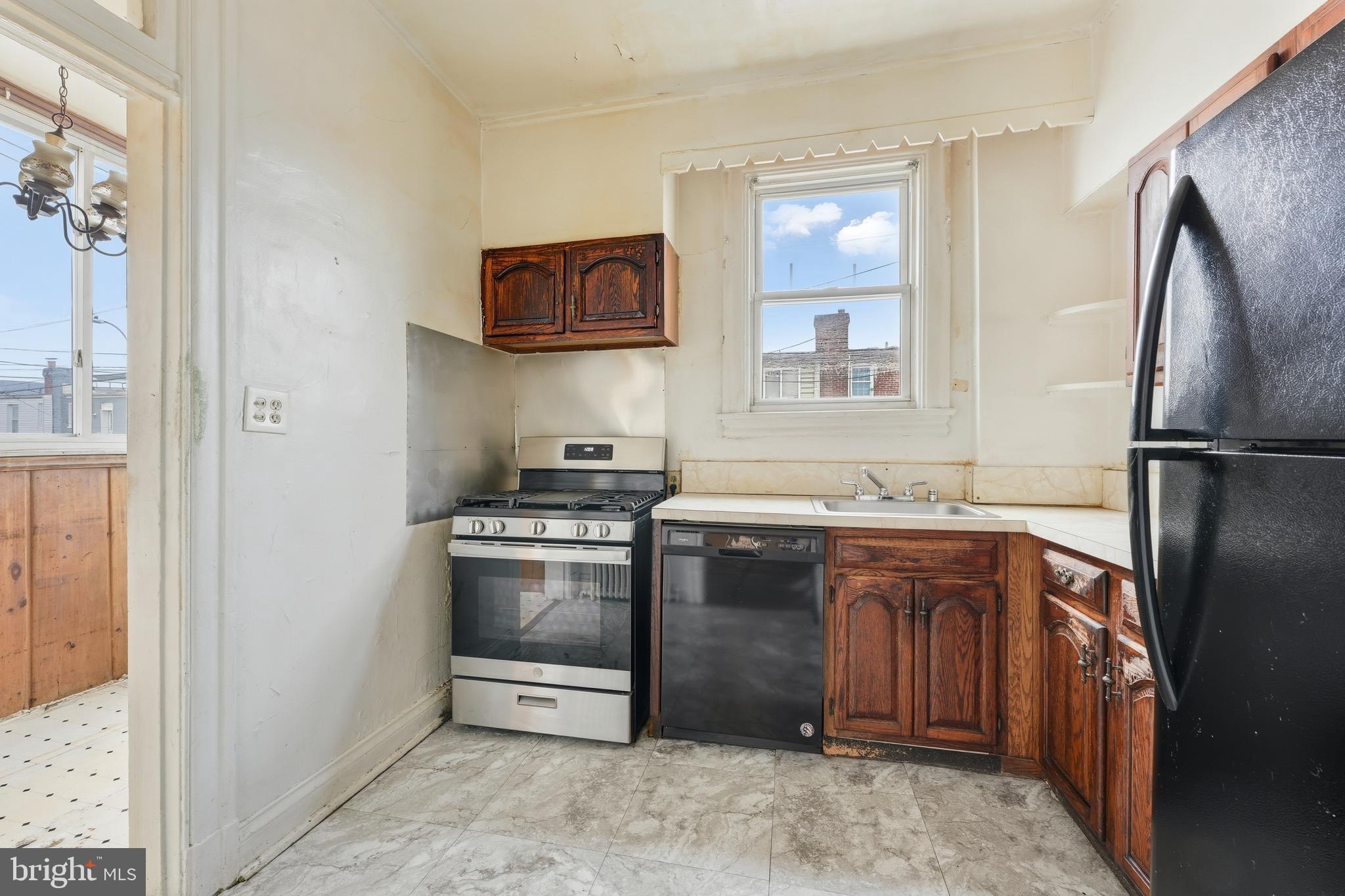 726 Somerset Place Northwest Washington, DC 20011 - Photo 9 of 28 a kitchen with stainless steel appliances granite countertop a refrigerator and a sink