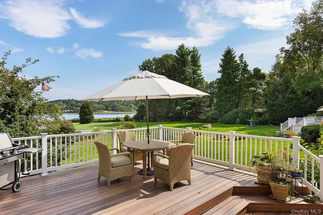 a view of a deck with furniture and wooden floor