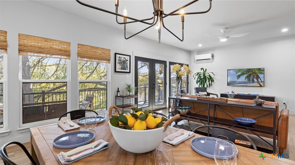 6786 River Road New Braunfels, TX 78132 - Photo 13 of 38 a living room with furniture and a floor to ceiling window
