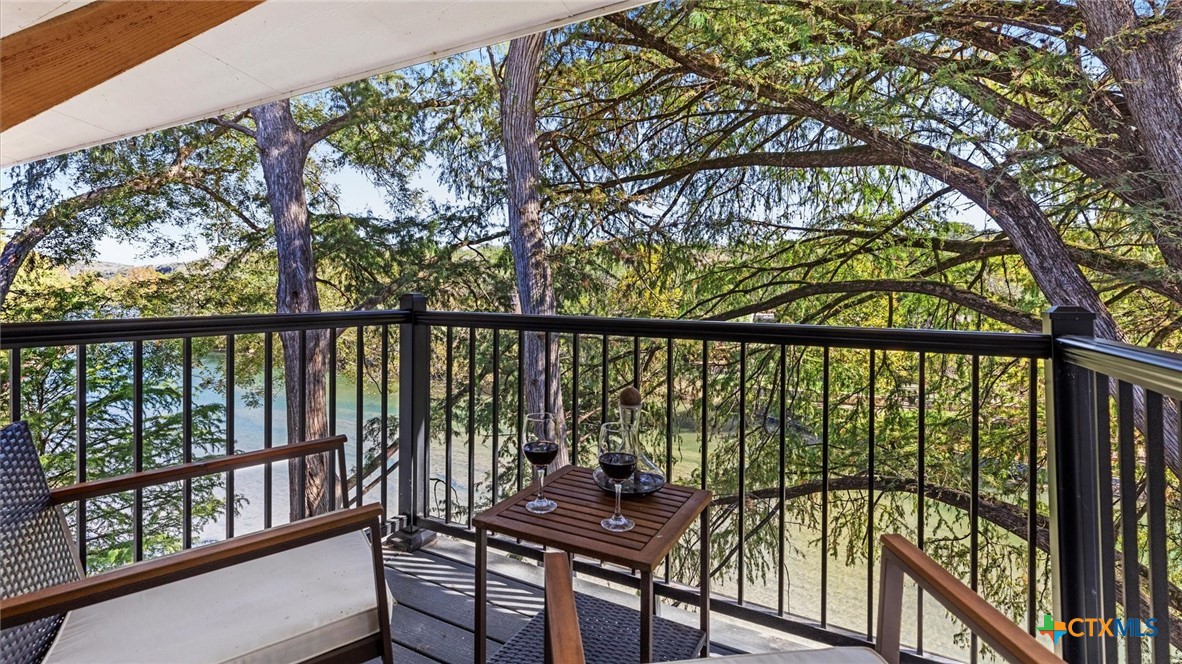 6786 River Road New Braunfels, TX 78132 - Photo 14 of 38 a view of a balcony with chairs
