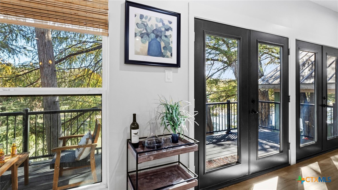 6786 River Road New Braunfels, TX 78132 - Photo 2 of 38 a living room with large windows