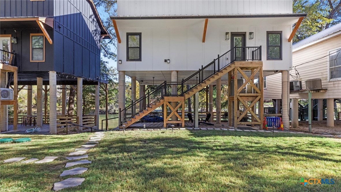 6786 River Road New Braunfels, TX 78132 - Photo 29 of 38 a view of a house with a yard