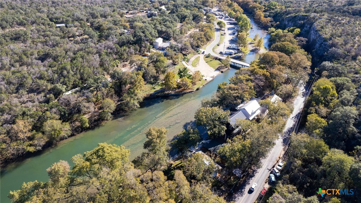 6786 River Road New Braunfels, TX 78132 - Photo 38 of 38 an aerial view of a house with a yard and lake view