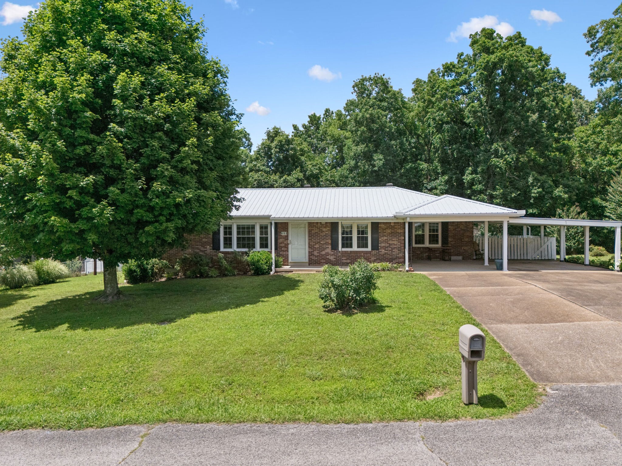 708 Hickory Street Centerville, TN 37033 - Photo 54 of 57 a front view of a house with a yard