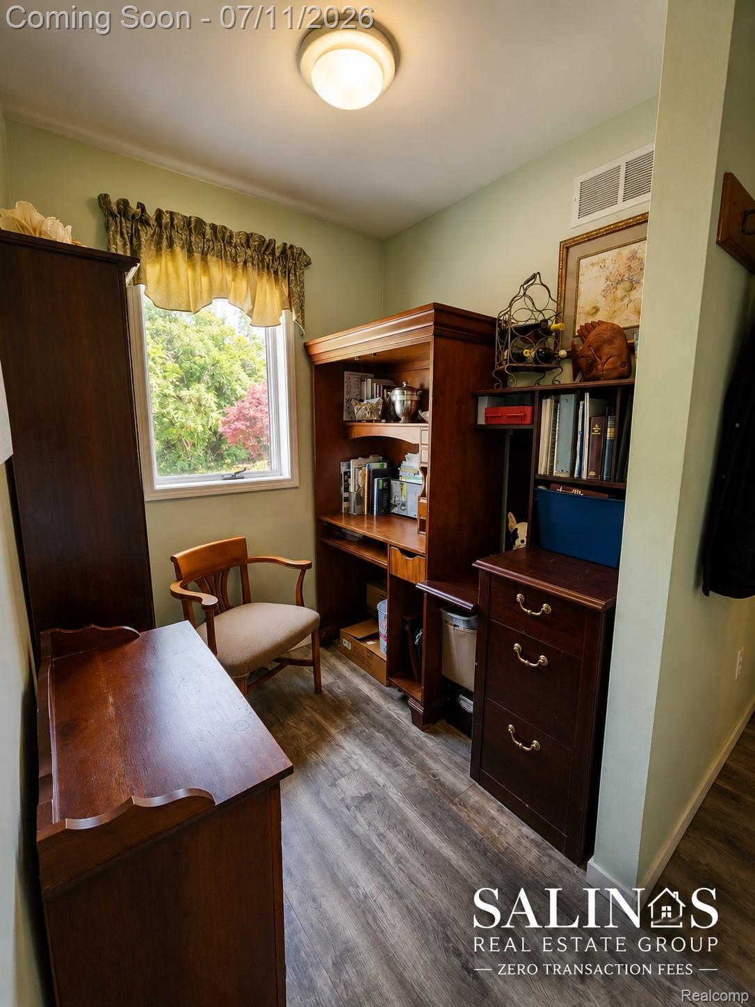 2120 Montague Road Davison, MI 48423 - Photo 34 of 37 Compact room featuring wood-finish flooring, a single window, and a built-in overhead light fixture