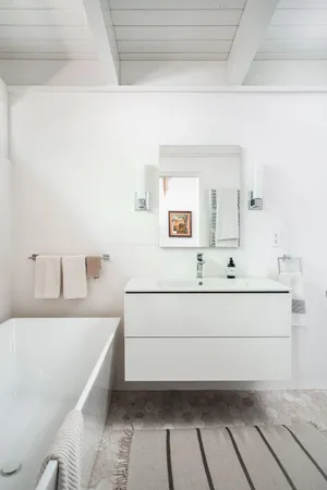 a bathroom with a bathtub and a sink