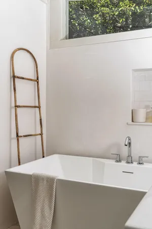 a bathroom with a bathtub and a sink