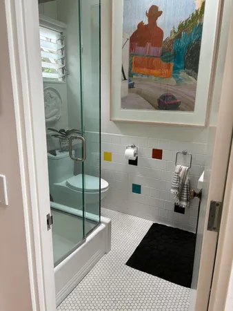 a bathroom with a bathtub and a shower