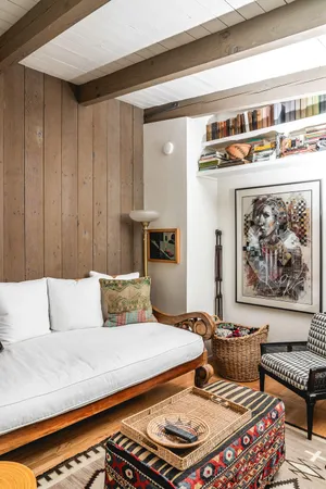 a bedroom with furniture and a rug