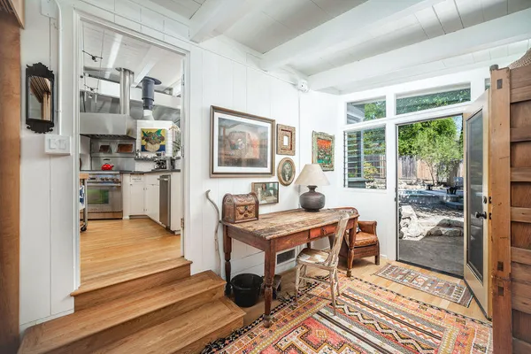a workspace with furniture and a rug