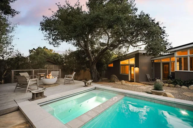 a view of a house with backyard patio and backyard