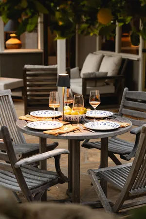 a patio with table and chairs
