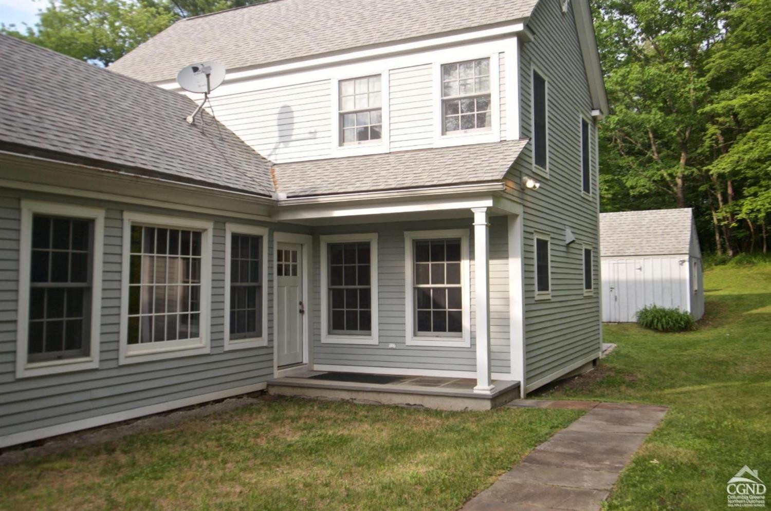 270 County 17 Valatie, NY 12184 - Photo 11 of 13 a view of a house with a large window and wooden fence