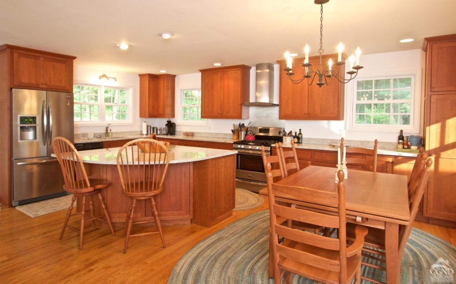 270 County 17 Valatie, NY 12184 - Photo 2 of 13 a view of a dining room with furniture a chandelier and wooden floor