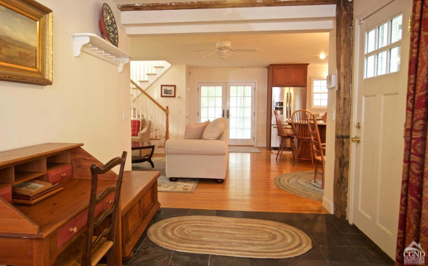 270 County 17 Valatie, NY 12184 - Photo 3 of 13 a living room with fireplace furniture and a window