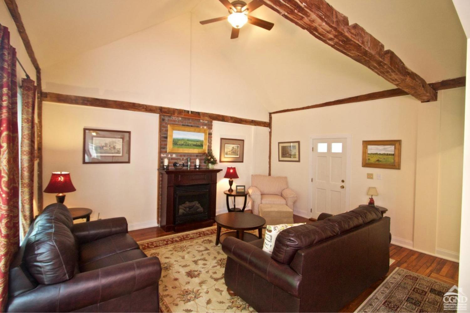 270 County 17 Valatie, NY 12184 - Photo 6 of 13 a living room with furniture and a fireplace