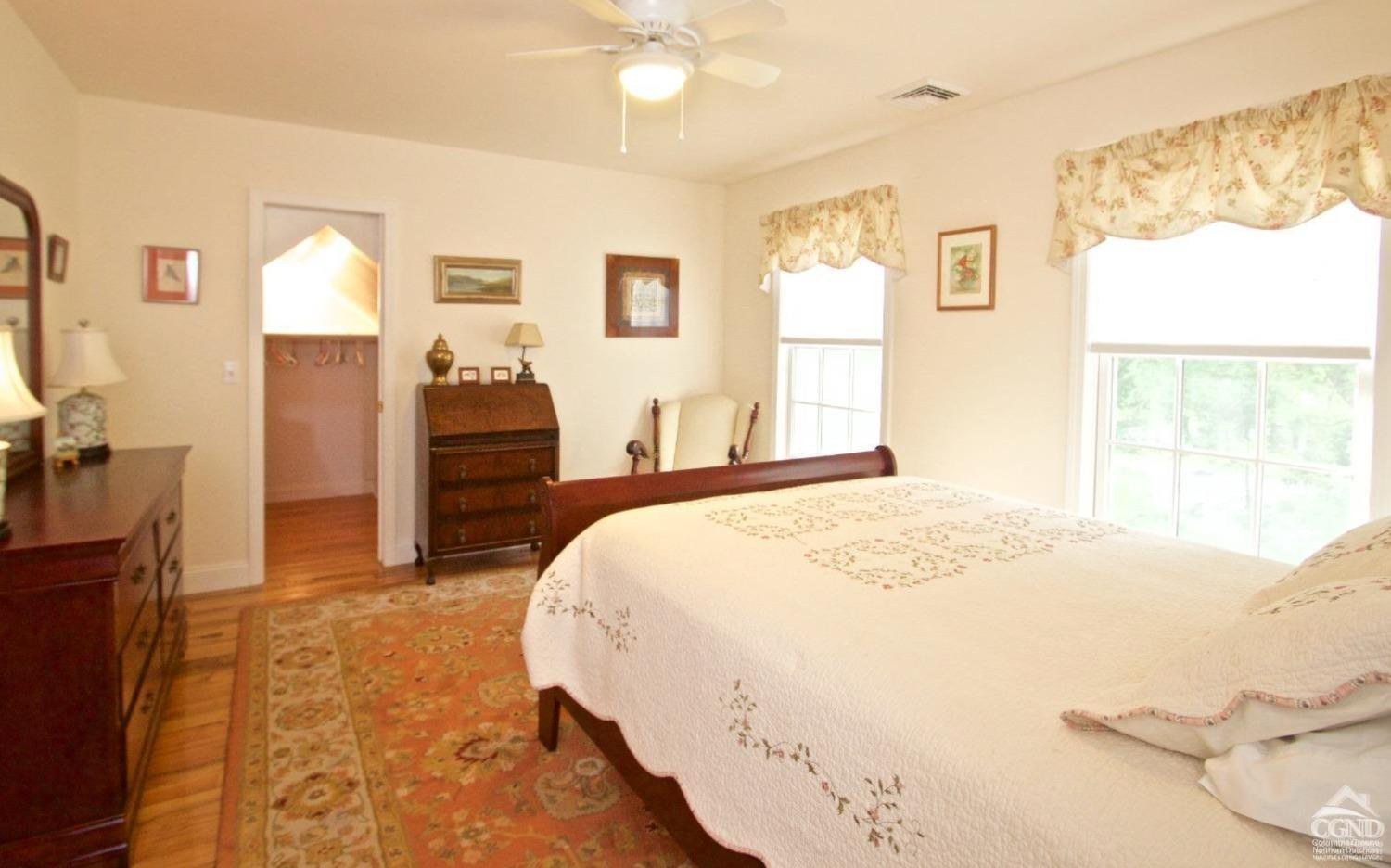 270 County 17 Valatie, NY 12184 - Photo 8 of 13 a spacious bedroom with a bed and a window