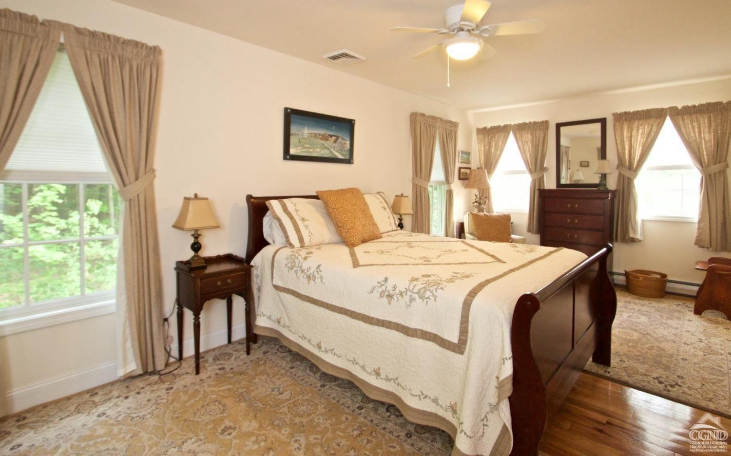 270 County 17 Valatie, NY 12184 - Photo 9 of 13 a bedroom with a bed and a chandelier