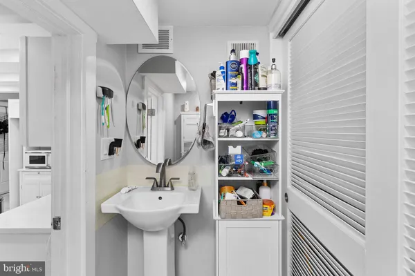 a bathroom with a sink and a mirror