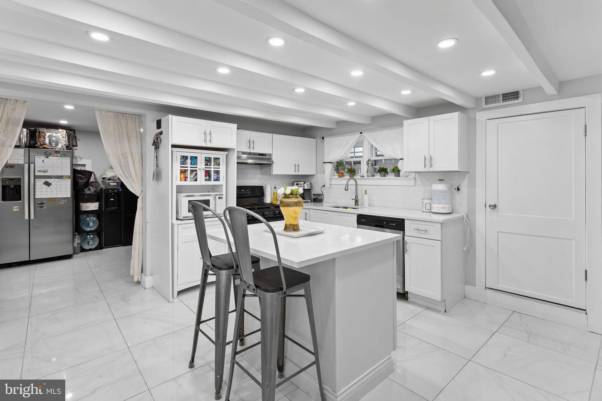 11 Main Street Englishtown, NJ 07726 - Photo 4 of 23 Modern kitchen with sleek white finishes.