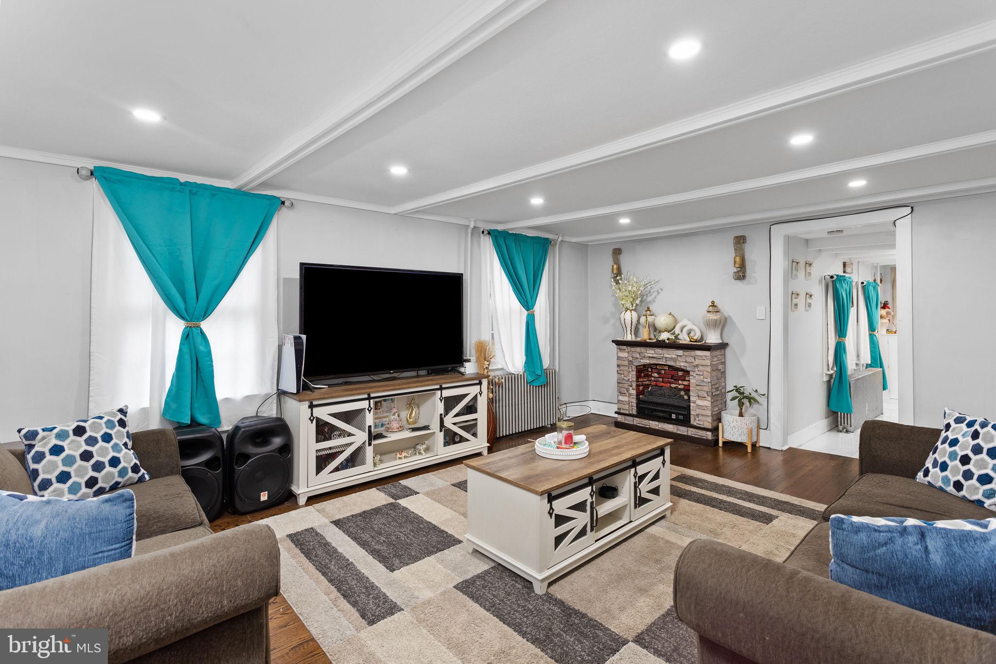 11 Main Street Englishtown, NJ 07726 - Photo 6 of 23 Cozy living space with vibrant accents.