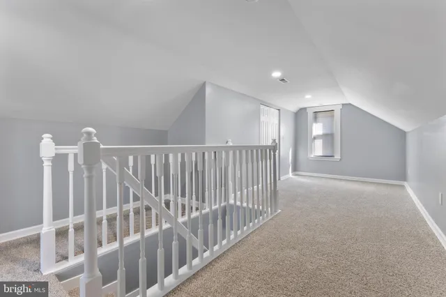 a view of an empty room with stairs