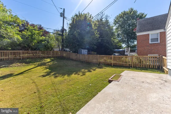 a view of a swimming pool with a backyard