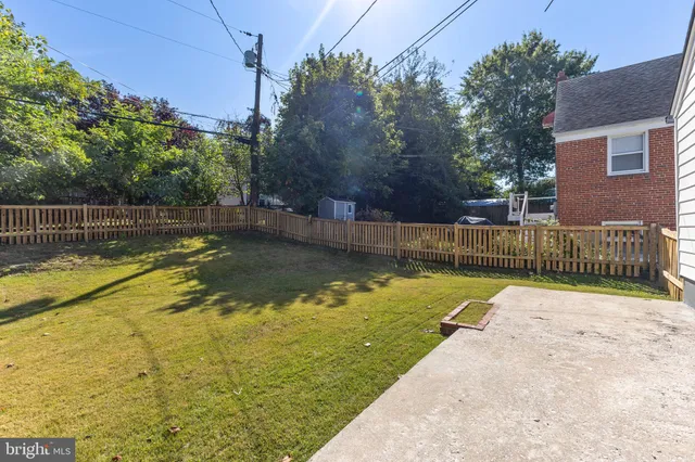 a view of a swimming pool with a backyard