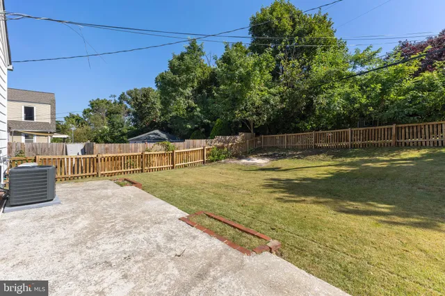 a view of swimming pool with an outdoor seating and yard