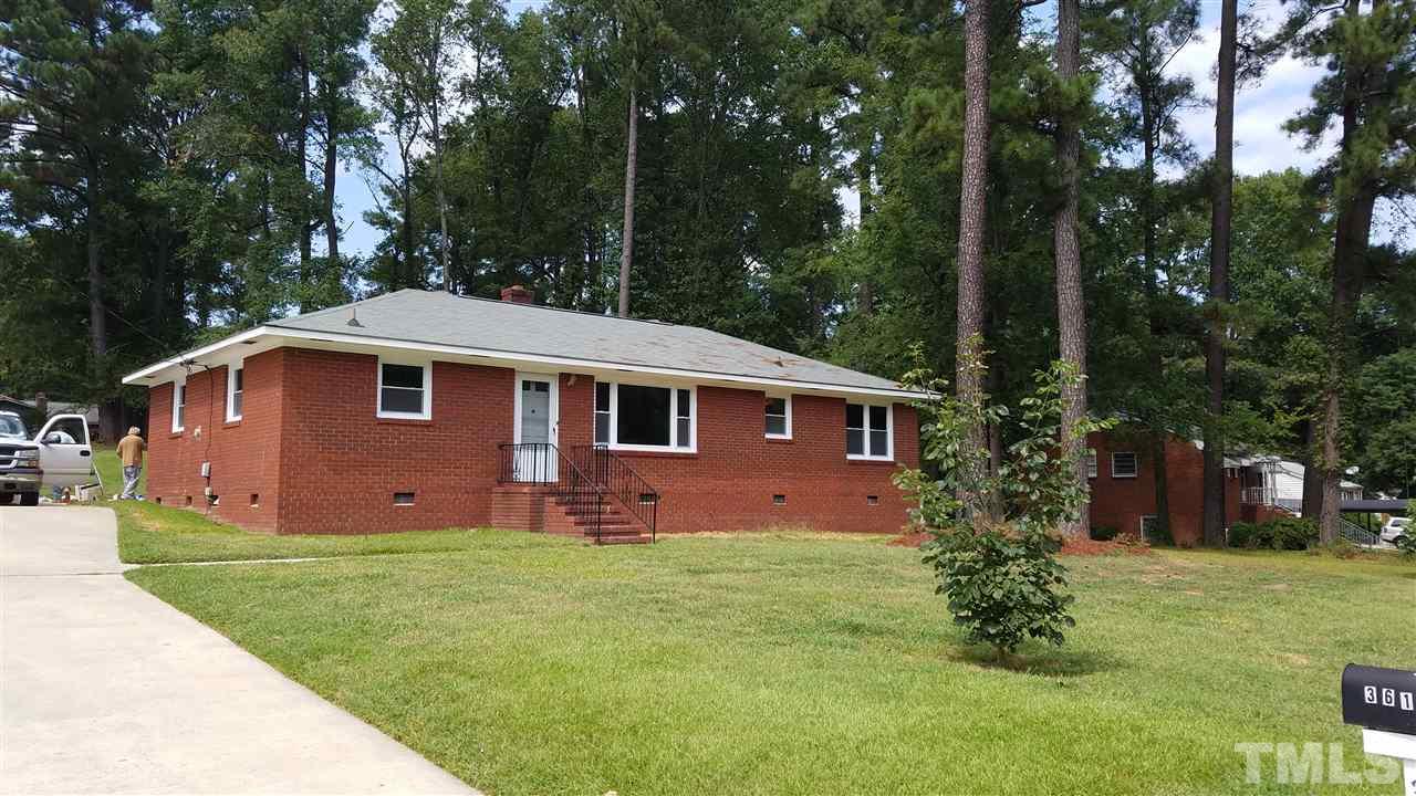 3616 Woodside Road Garner, NC 27529 - Photo 2 of 11 a front view of a house with a garden