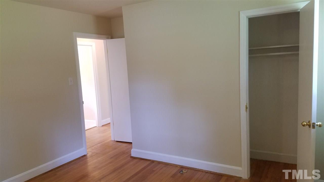 3616 Woodside Road Garner, NC 27529 - Photo 7 of 11 a view of an empty room with wooden floor and closet