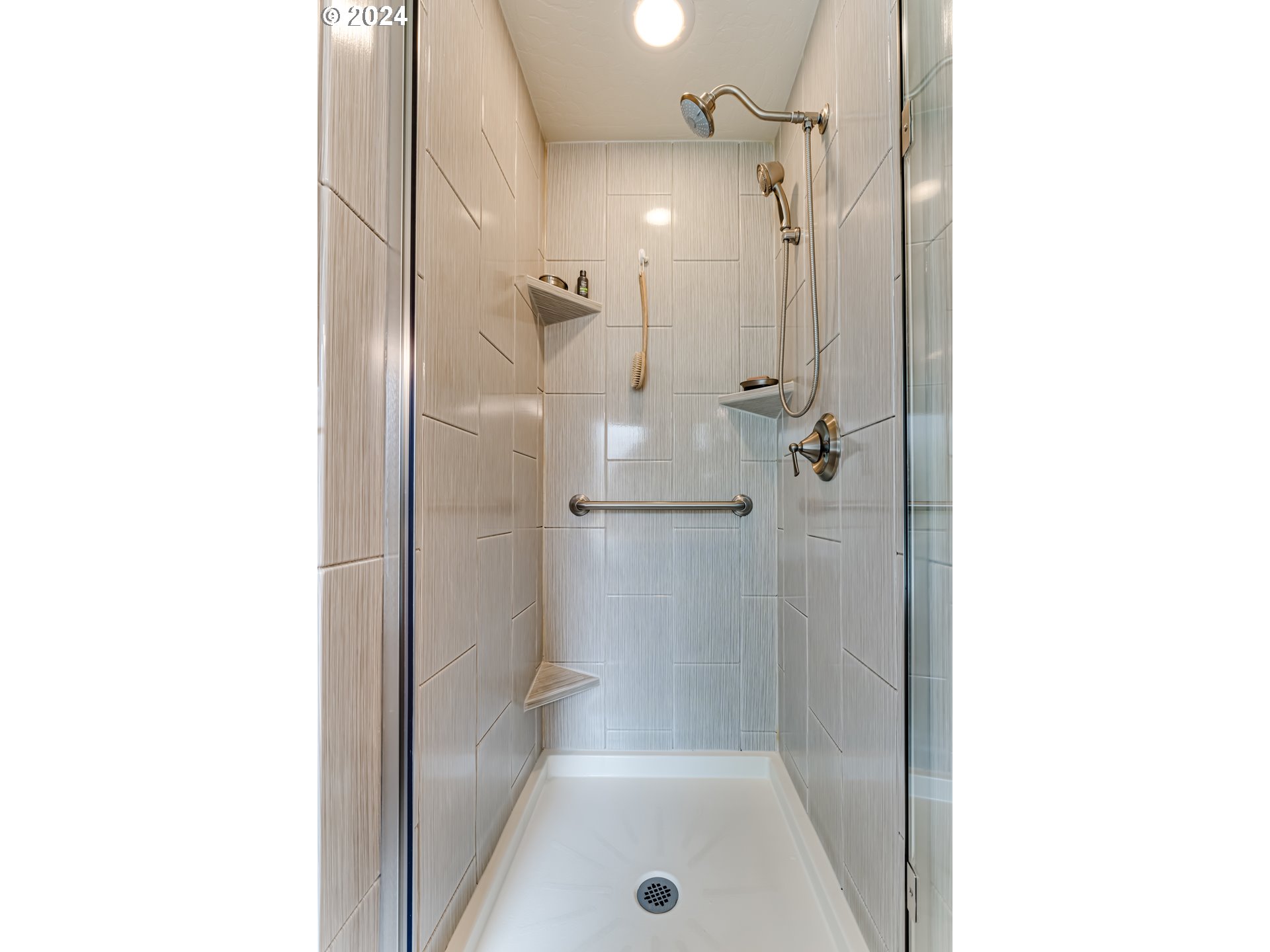 1547 Canal Street Springfield, OR 97477 - Photo 24 of 37 a bathroom with a bathtub and a shower