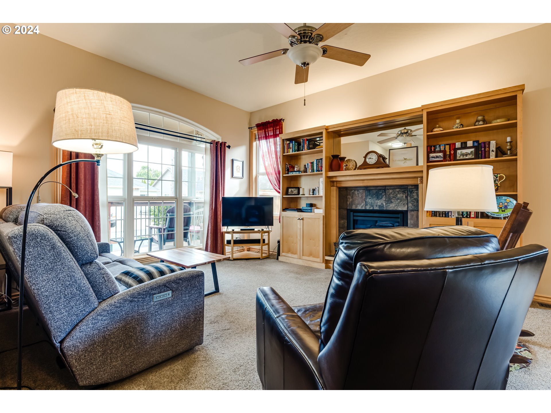 1547 Canal Street Springfield, OR 97477 - Photo 5 of 37 a living room with furniture a flat screen tv and a fireplace