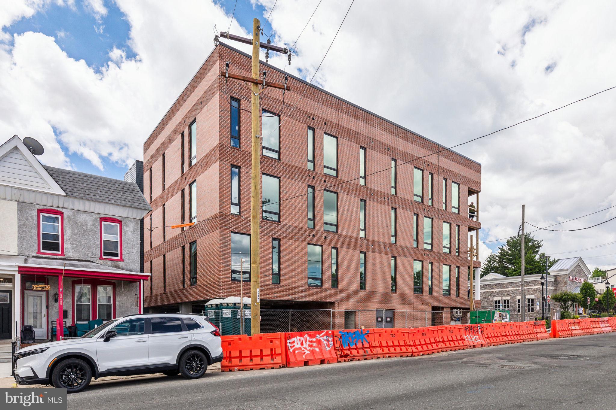 6910 Ridge Avenue, Unit 306 Philadelphia, PA 19128 - Photo 19 of 19 a car parked in front of a building