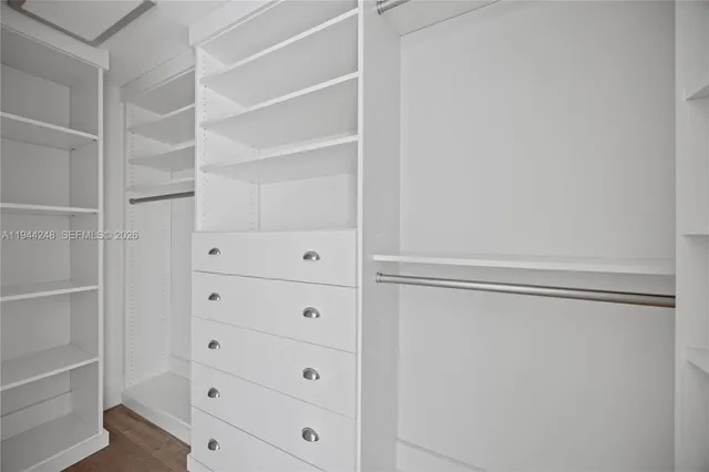 a view of an empty walk in closet