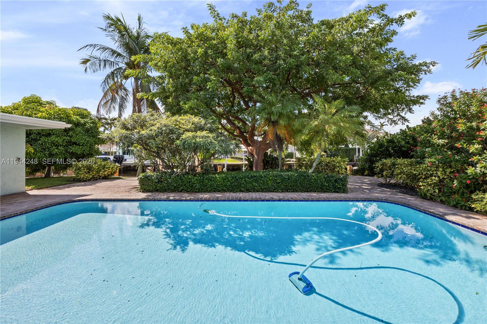 2530 Northeast 48th Street Lighthouse Point, FL 33064 - Photo 19 of 23 a view of a swimming pool and outdoor space