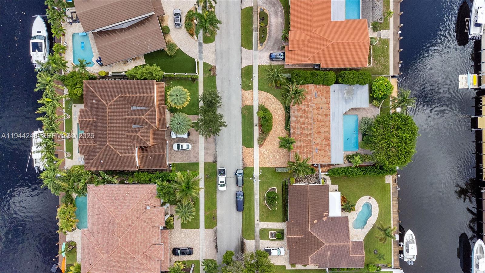 2530 Northeast 48th Street Lighthouse Point, FL 33064 - Photo 22 of 23 aerial view of a house with yard and swimming pool