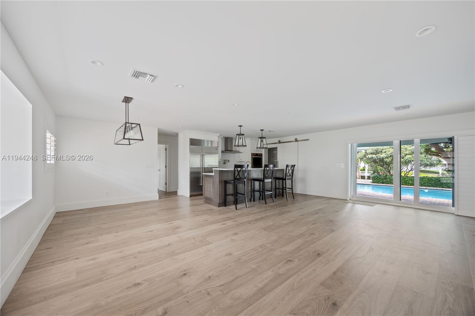 2530 Northeast 48th Street Lighthouse Point, FL 33064 - Photo 3 of 23 a view of a livingroom with furniture window and outside view