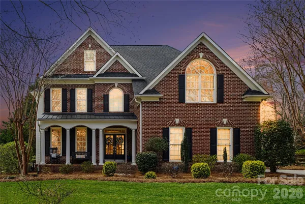 a front view of a house with yard