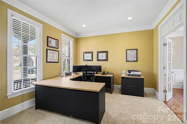 a living room with furniture and windows