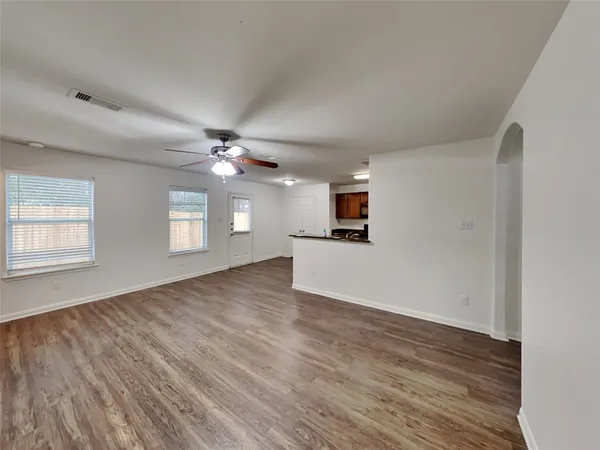 a view of hallway with wooden floor