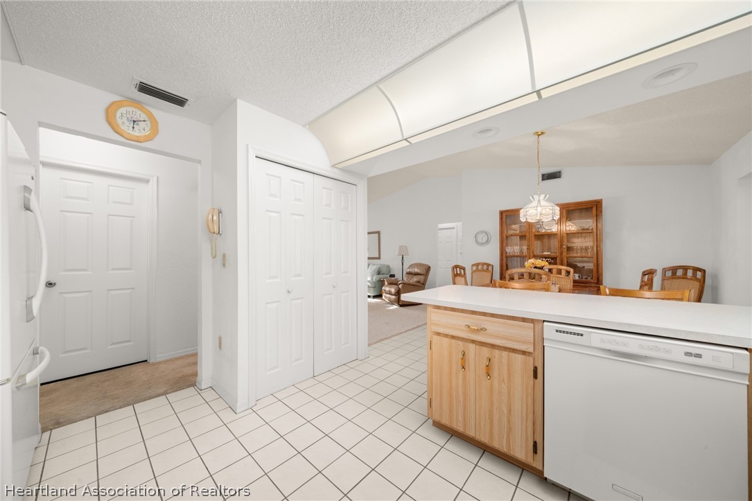 5802 Golden Road Sebring, FL 33875 - Photo 14 of 37 a kitchen with white cabinets and sink