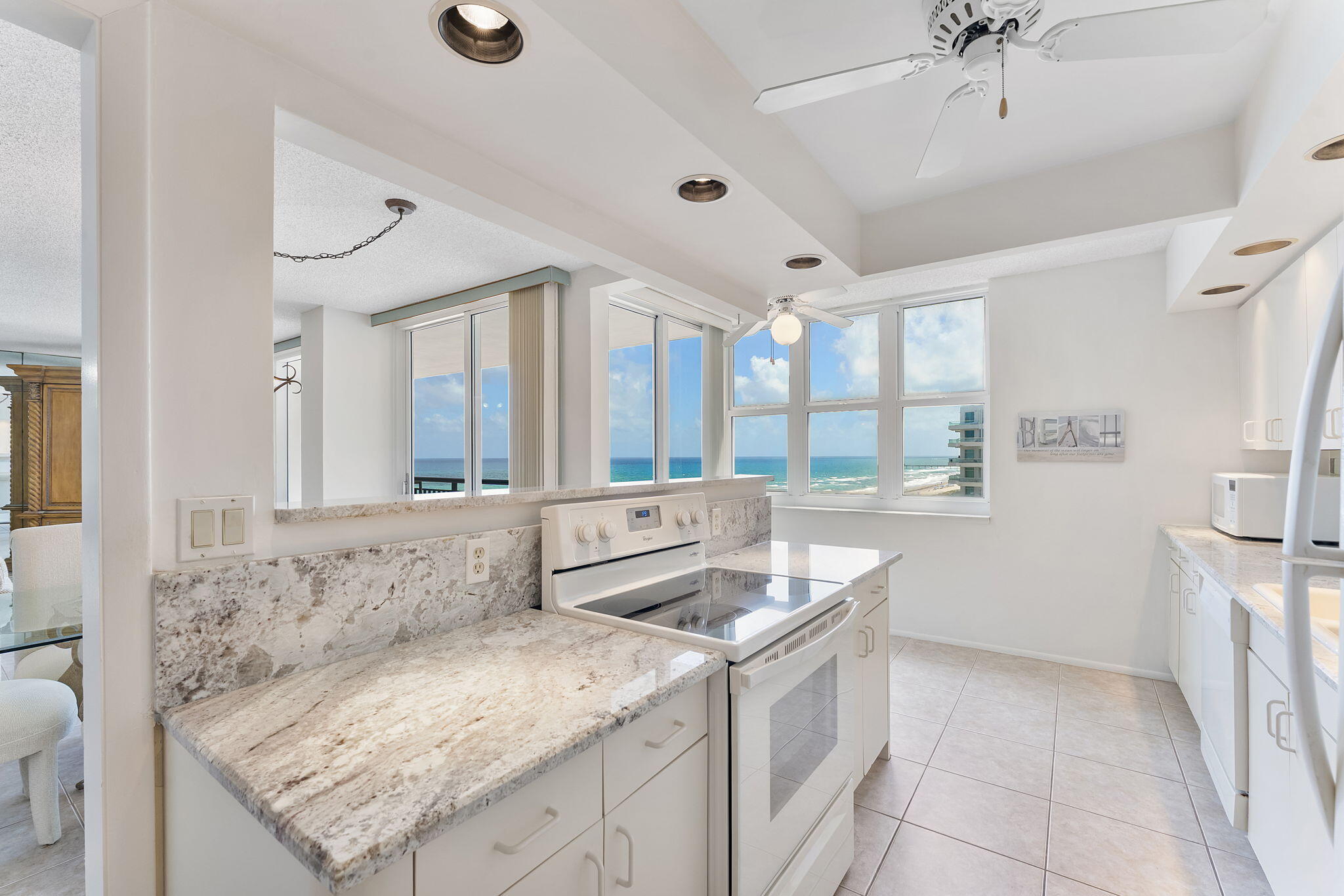 2000 South Ocean Boulevard, Unit 10H Boca Raton, FL 33432 - Photo 13 of 54 a bathroom with a granite countertop sink and a mirror