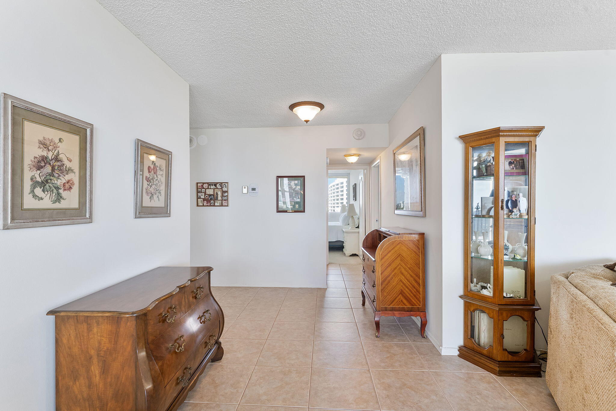 2000 South Ocean Boulevard, Unit 10H Boca Raton, FL 33432 - Photo 17 of 54 a living room with furniture and a couch
