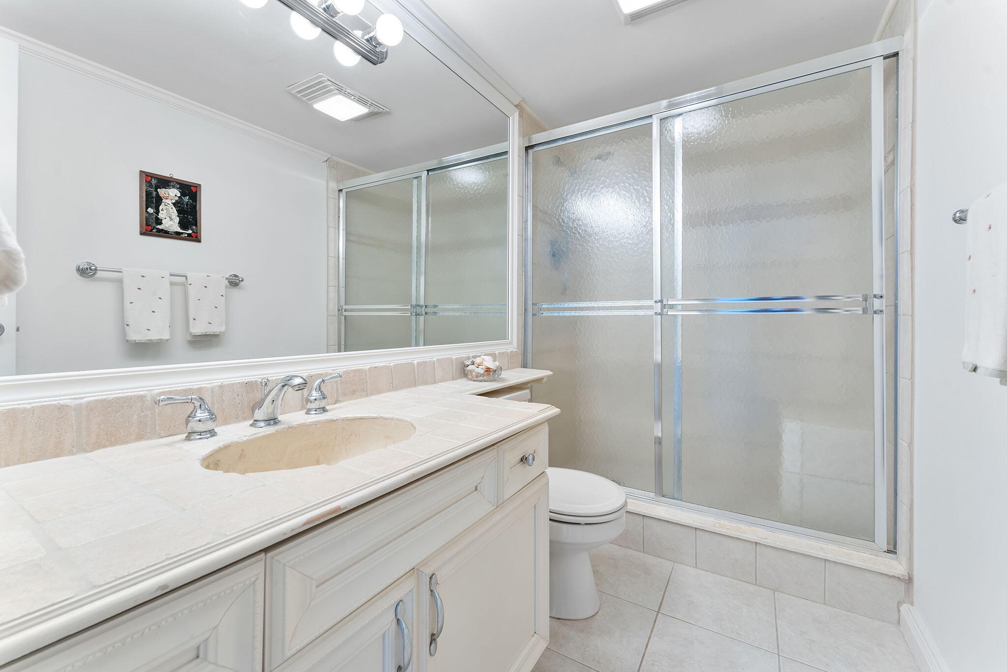 2000 South Ocean Boulevard, Unit 10H Boca Raton, FL 33432 - Photo 23 of 54 a bathroom with a sink a toilet and shower