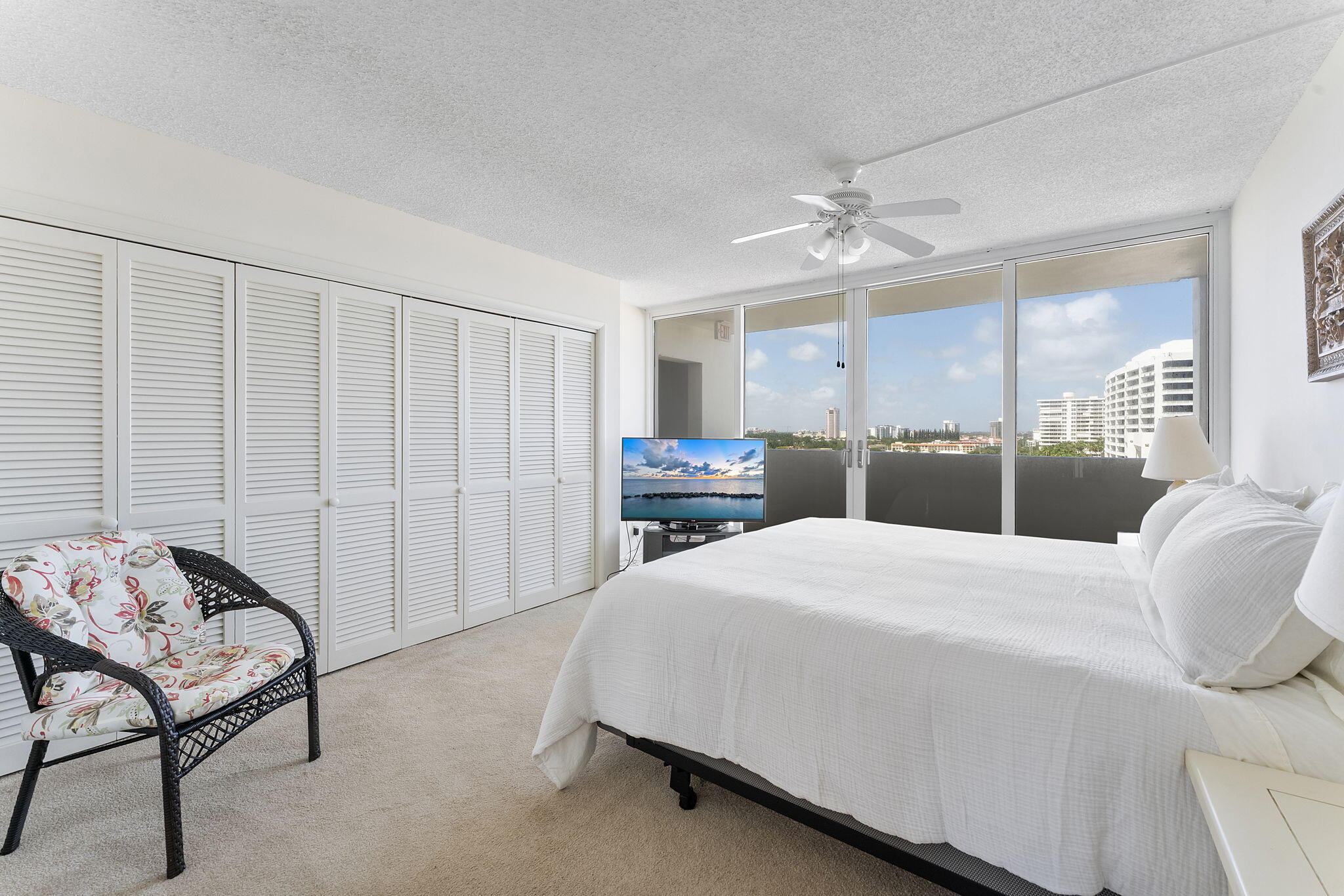 2000 South Ocean Boulevard, Unit 10H Boca Raton, FL 33432 - Photo 24 of 54 a bedroom with a bed a table and chair